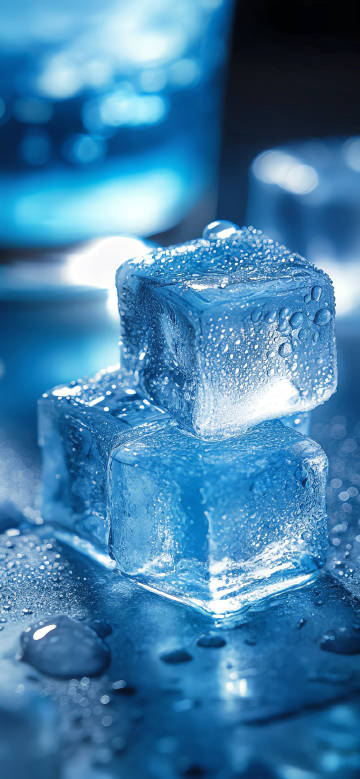 Pure ice cube with water droplets on the surface